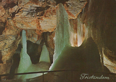 Cave interior with stalactites and stalagmites, featuring the brand 'Tristandsm'.