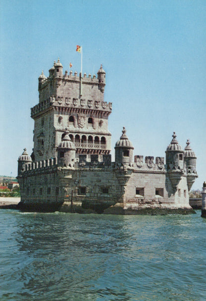 Belem Tower in Lisbon, Portugal, with a clear blue sky.