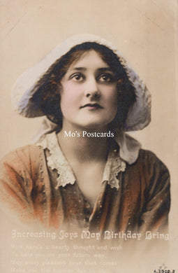 Vintage-style postcard with a woman wearing a white bonnet and brown dress, featuring 'Mo's Postcards' branding.