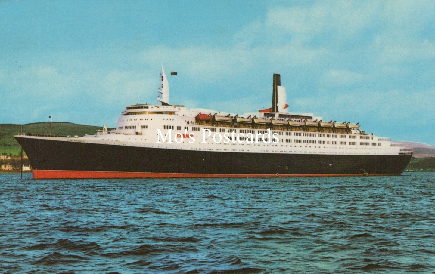 Cruise ship on water with a clear sky