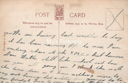 Vintage postcard with handwritten text and a red stamp, featuring the brand 'Mo's Postcards'.