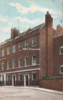 Vintage postcard of a brick building in London  