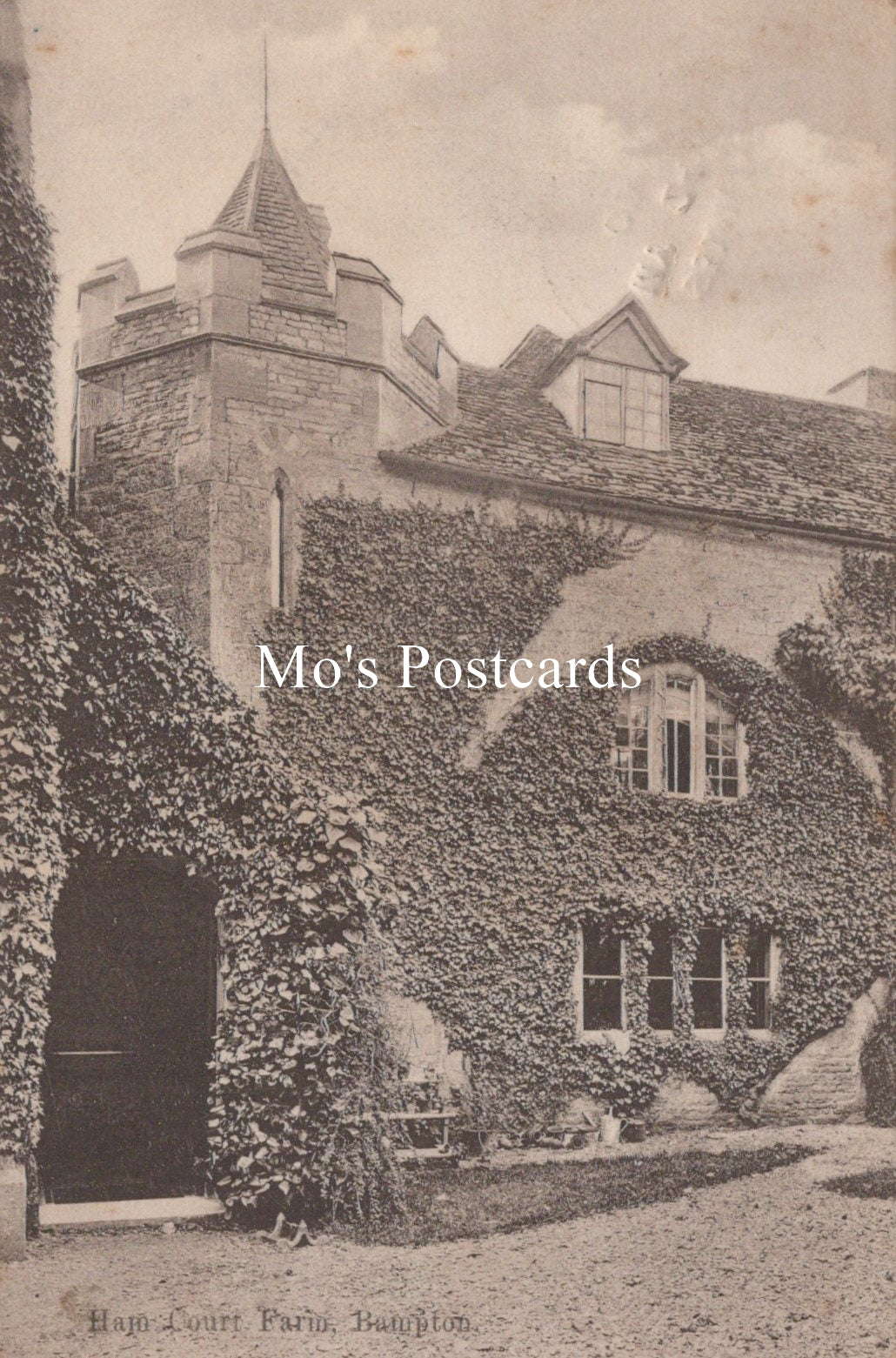 Vintage postcard of a large house with ivy-covered walls and a tower, labeled 'Mo's Postcards'.