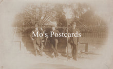 Load image into Gallery viewer, Vintage sepia-toned photo of three men with hand tools
