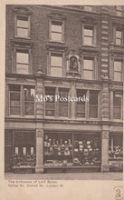 Load image into Gallery viewer, Vintage black and white postcard of a building facade with a store front, labeled &#39;Mo&#39;s Postcards&#39;.
