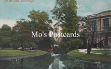 Load image into Gallery viewer, Vintage-style postcard with a scenic view of a building and trees 
