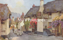 Load image into Gallery viewer, Painting of a quaint village street with thatched cottages and sheep 
