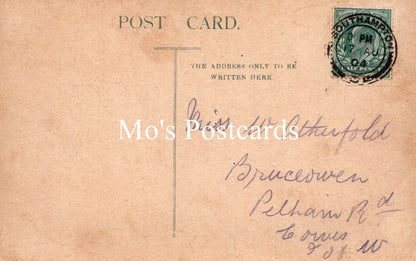 Vintage postcard with handwritten address and a stamp 