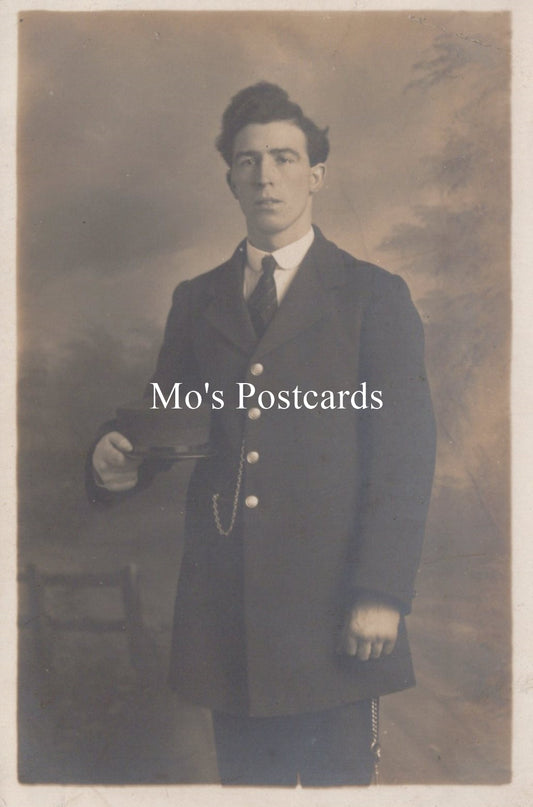 Vintage sepia-toned portrait of a man in formal attire  