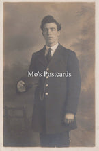 Load image into Gallery viewer, Vintage sepia-toned portrait of a man in formal attire  
