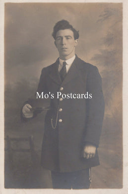Vintage sepia-toned portrait of a man in formal attire  
