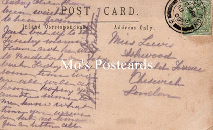 Vintage postcard with handwritten text and a stamp 