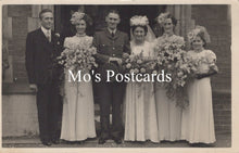 Load image into Gallery viewer, Vintage black and white photo of a wedding party with bouquets 
