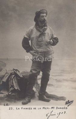 Vintage postcard of a man in a fishing outfit with text and signature