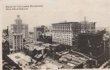 Load image into Gallery viewer, Vintage black and white photo of large buildings in New Orleans, LA.
