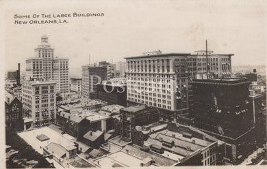 Vintage black and white photo of large buildings in New Orleans, LA.