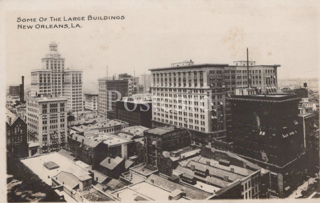 Vintage black and white photo of large buildings in New Orleans, LA.