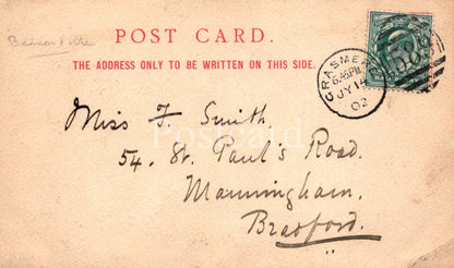 Vintage postcard with text and stamp, featuring a handwritten address.