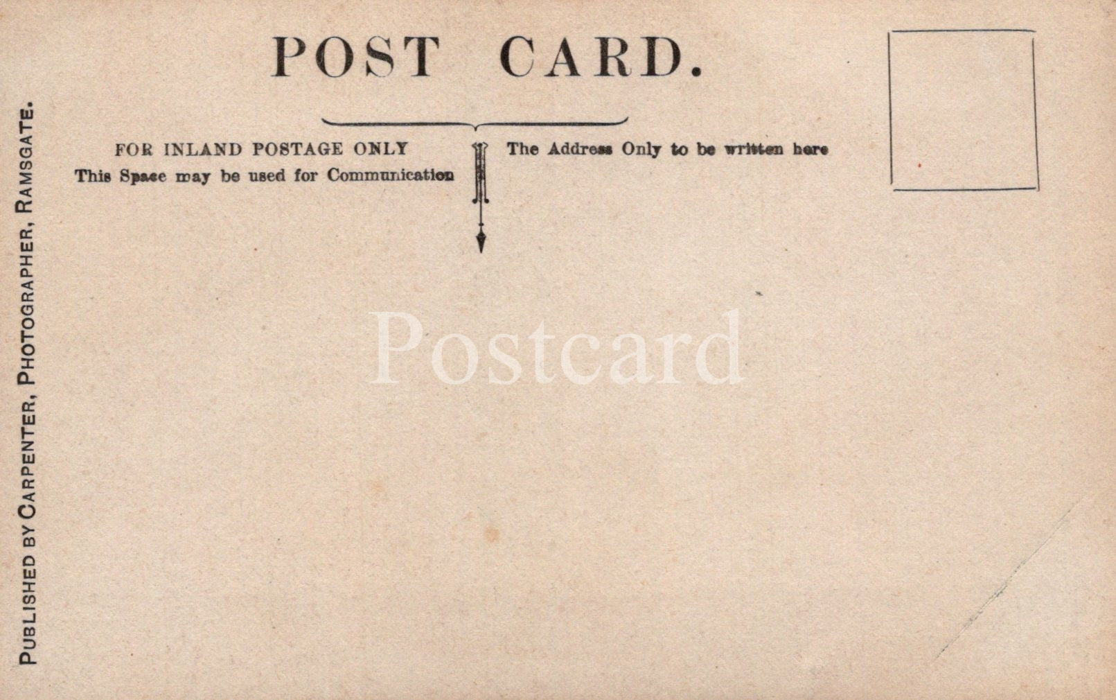 Back of a vintage postcard with text and a stamp