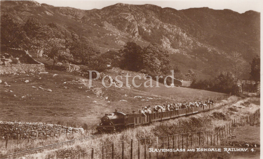 Vintage postcard of a steam train on a mountainous railway line with sheep in the foreground.