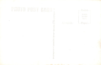 White paper with printed text and a ruler on a white background