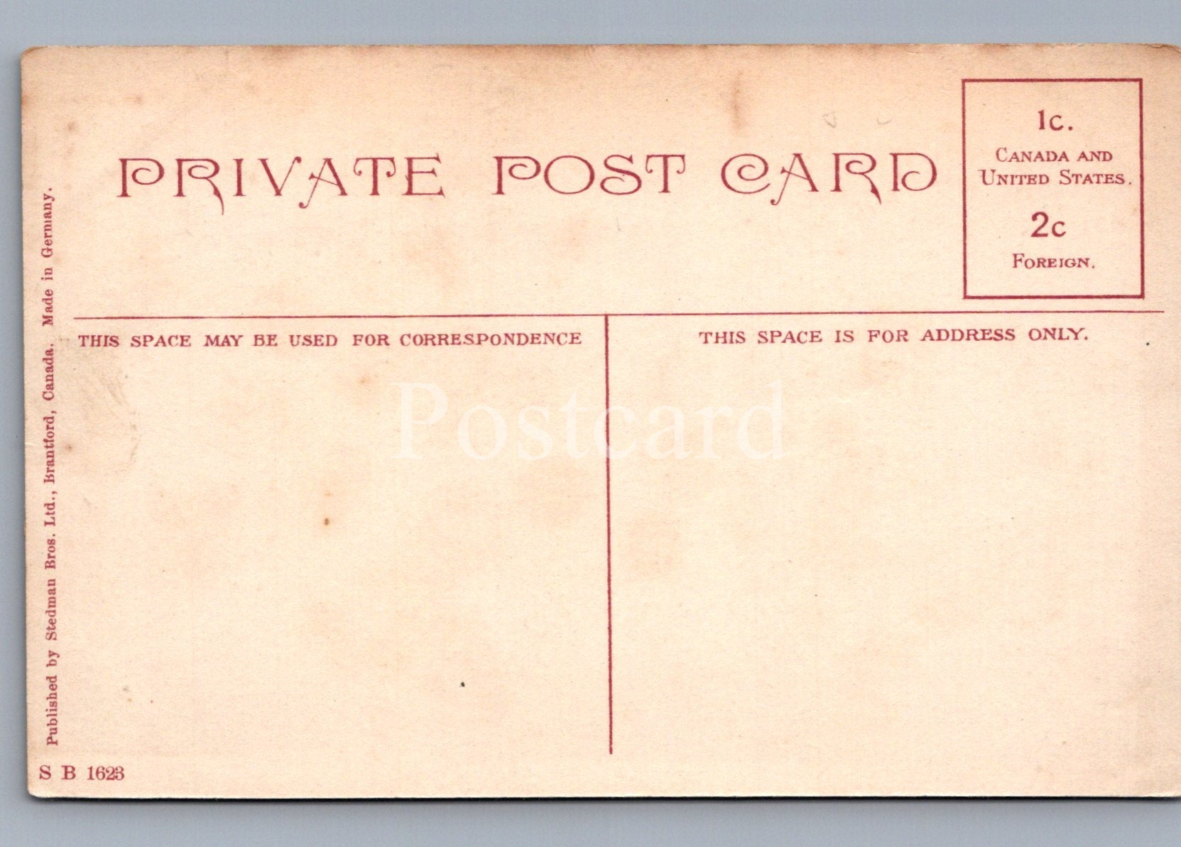 Back of a vintage postcard with red text on a beige background