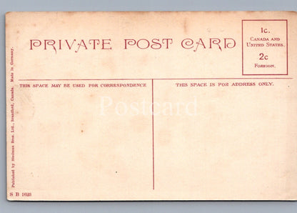 Back of a vintage postcard with red text on a beige background