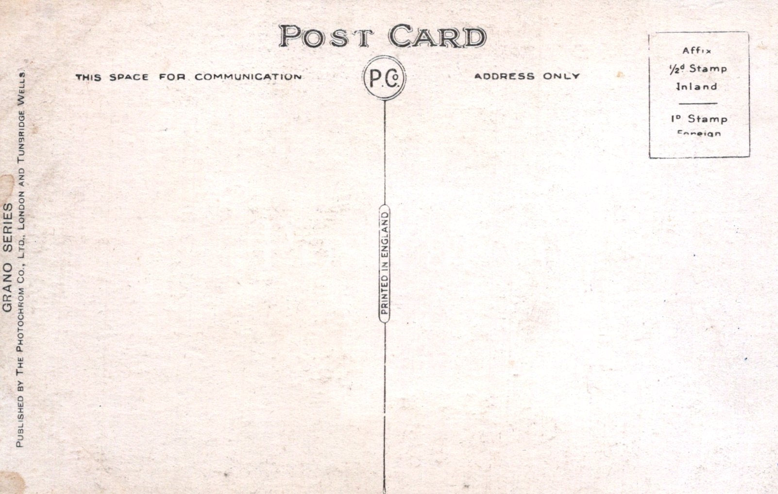 Back of a vintage postcard with printed text and stamps.