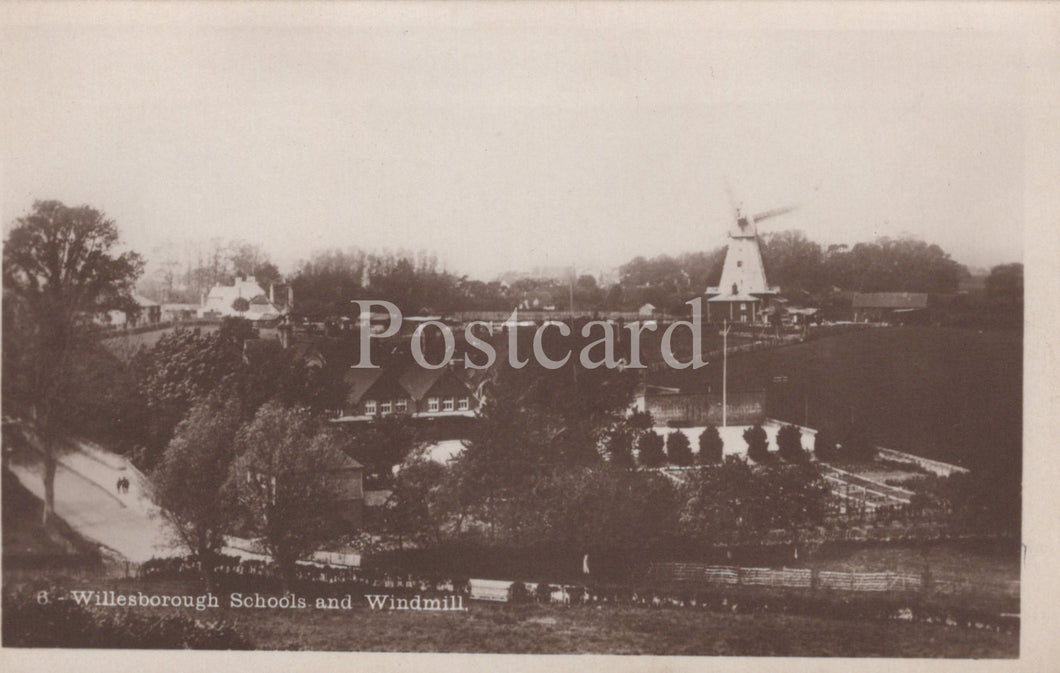 Vintage black and white postcard of Willesborough Schools and Windmill