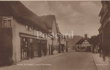 Load image into Gallery viewer, Vintage sepia-toned postcard of King Street, Knutsford with buildings on either side.
