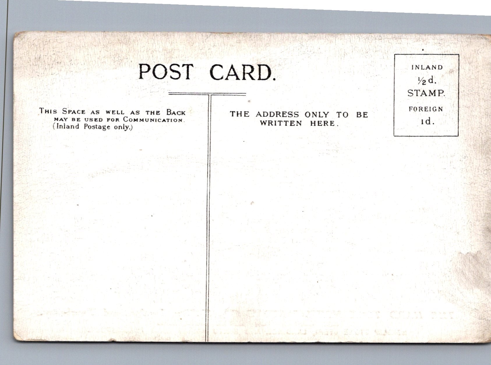 Back of a vintage postcard with text and postage information.