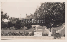 Load image into Gallery viewer, Vintage black and white postcard of a residential area with houses and trees.
