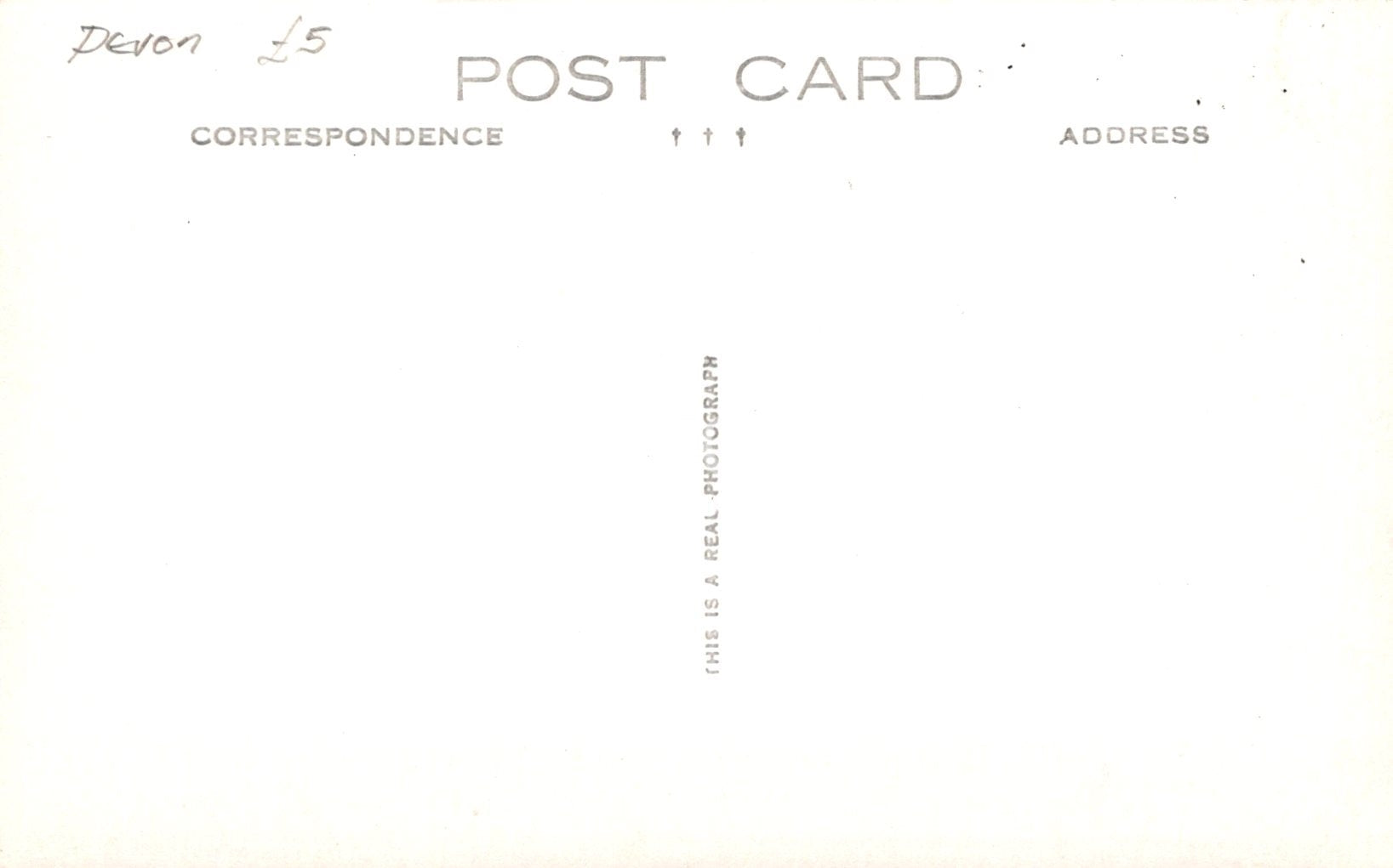 Placeholder postcard with text 'This is a real photograph' on a white background