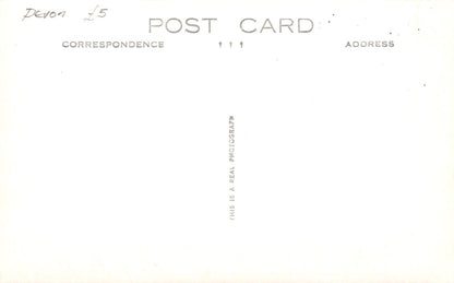 Placeholder postcard with text 'This is a real photograph' on a white background
