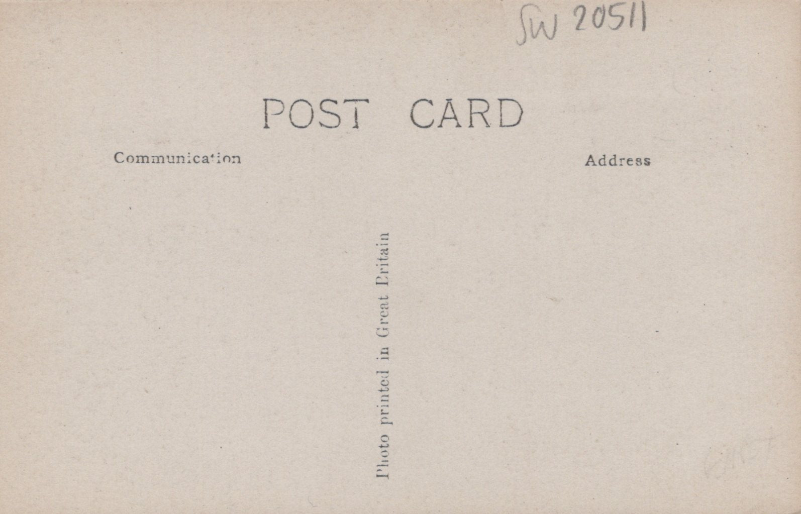 Back of a vintage postcard with text and a stamp
