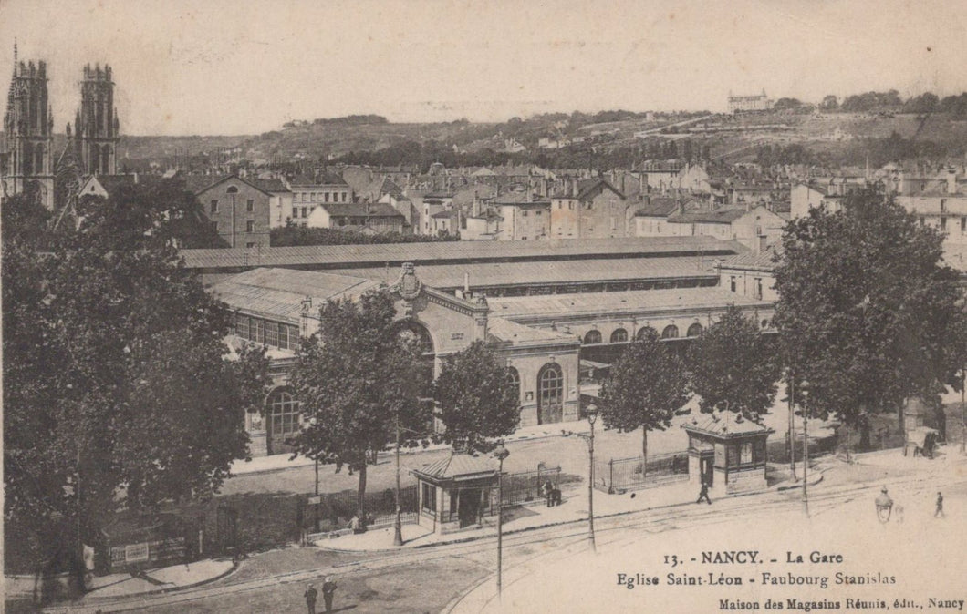 Vintage postcard of a train station in Nancy with trees and buildings in the background