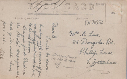 Vintage postcard with handwritten text on a blue background