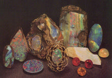 Load image into Gallery viewer, Collection of opal stones and crystals on a dark background
