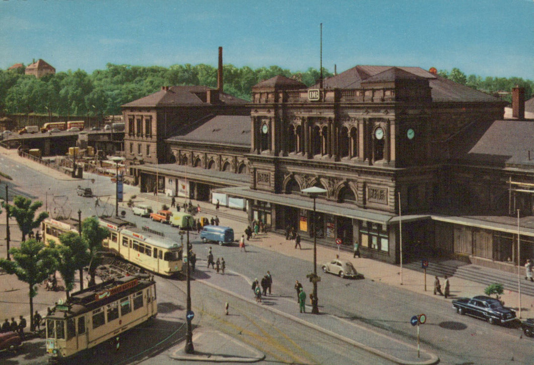 Vintage-style painting of a city street with tram tracks, buildings, and people.