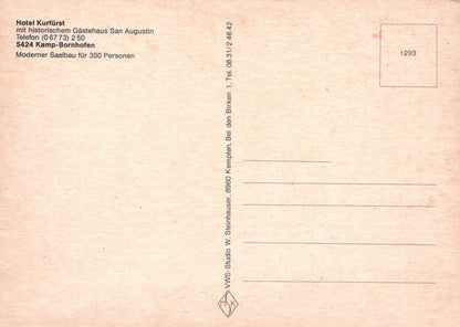 Back of a postcard with text and a grid for addressing, on a pinkish-beige background.