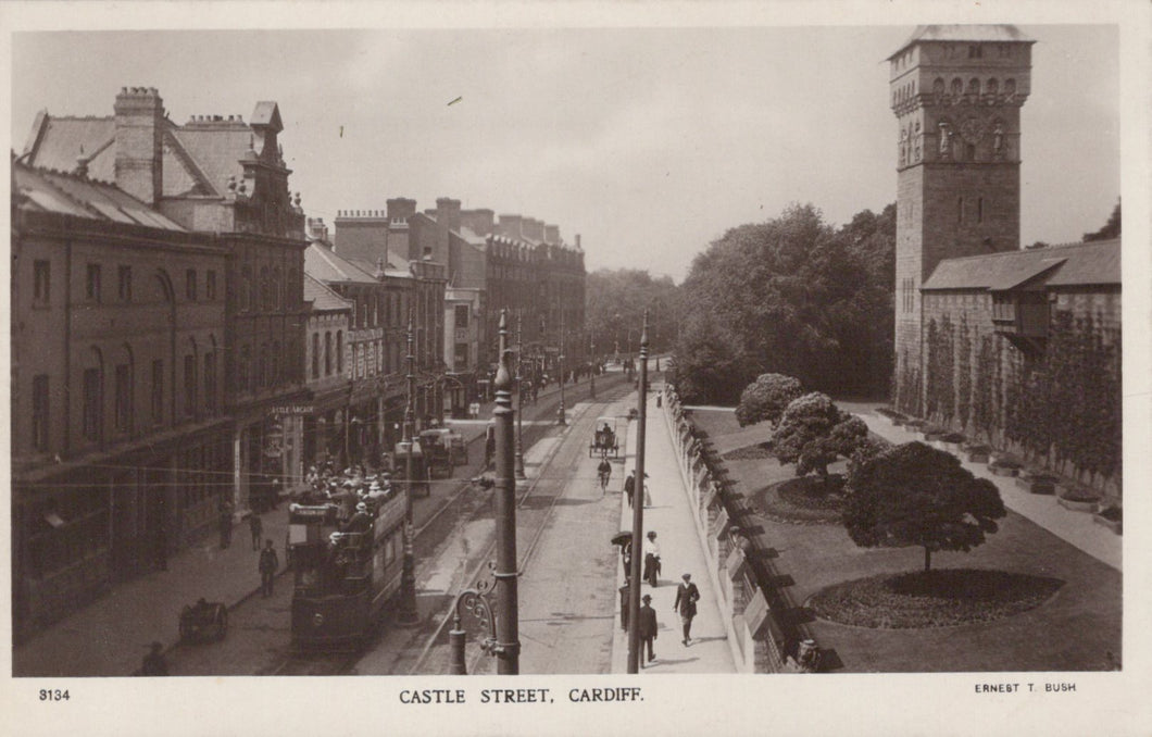 Vintage black and white photograph of Castle Street, Cardiff with buildings and a tram.
