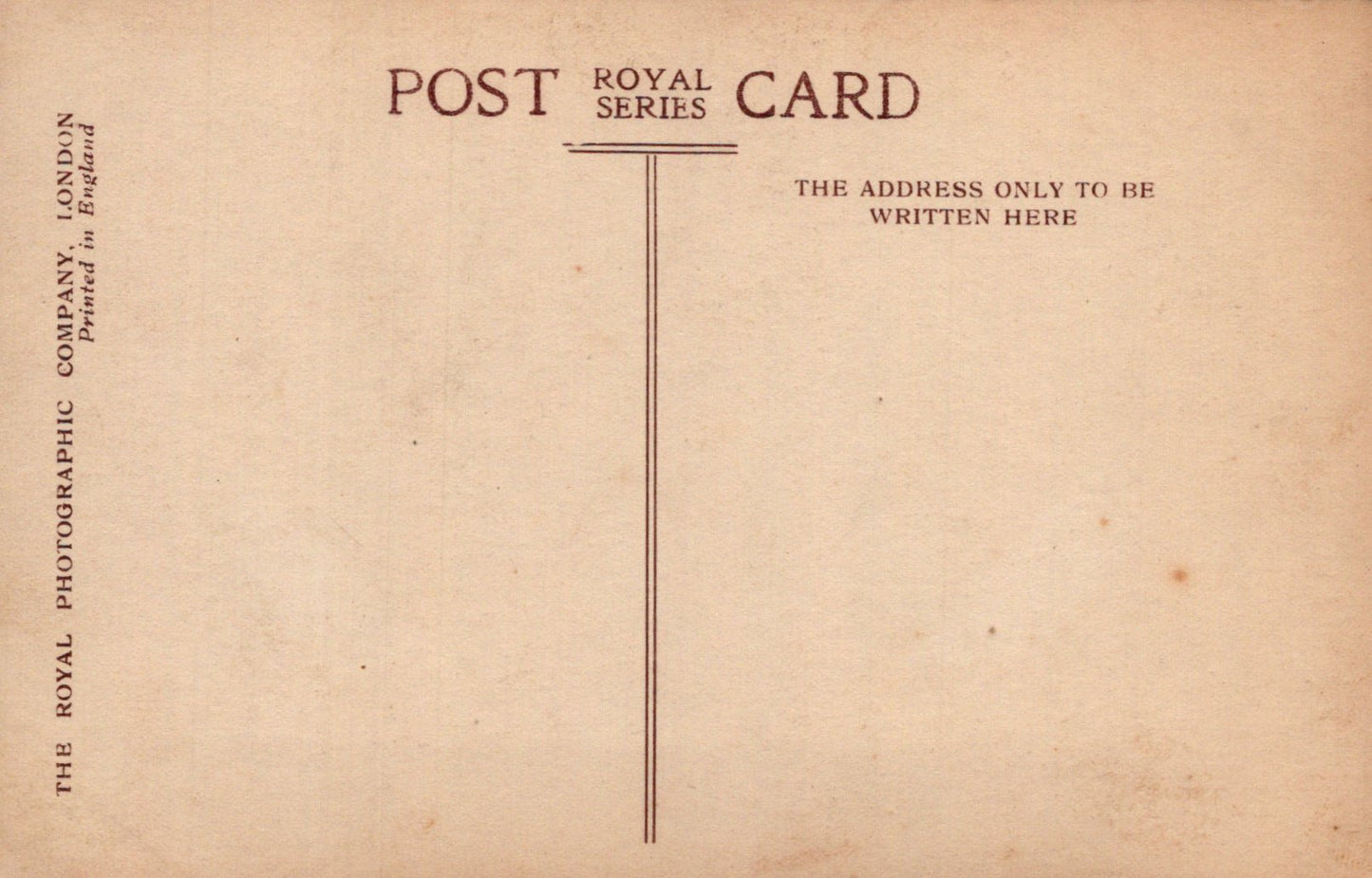Vintage postcard with text and a line for address on a brown background