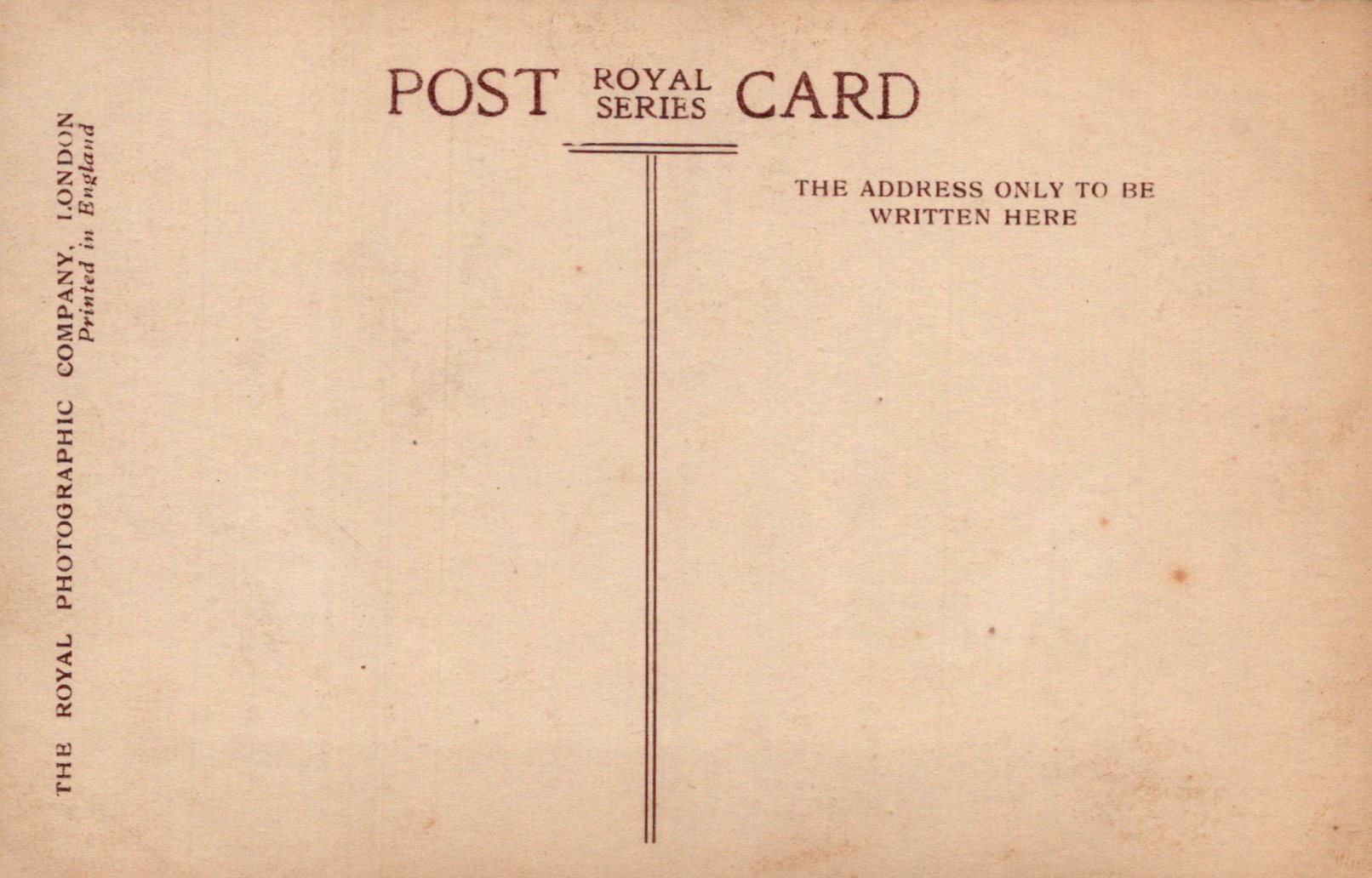 Vintage postcard with text and a line for address on a brown background