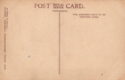 Back of a vintage postcard with text and a vertical line for writing the address.