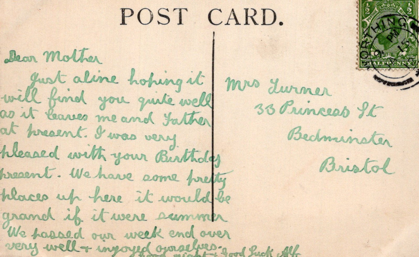 Vintage postcard with handwritten text and a stamp on the back