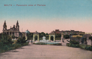 Panoramic view of Floriana, Malta with historical buildings and a fountain.