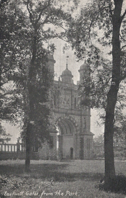 Vintage photograph of Eastwell Gates from the park, featuring a large archway with decorative elements.
