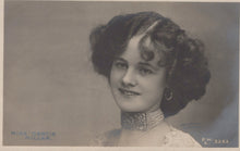 Load image into Gallery viewer, Vintage black and white portrait of a woman with styled hair and jewelry.
