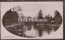 Load image into Gallery viewer, Vintage-style black and white photo of a river with trees 
