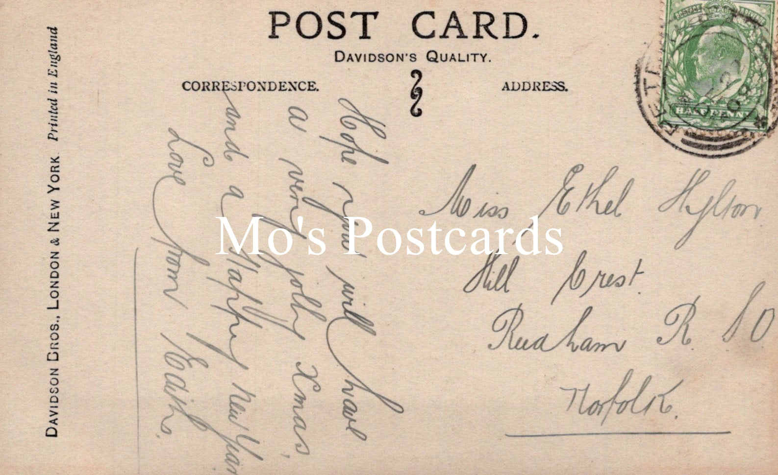 Vintage postcard with handwritten text and a stamp.